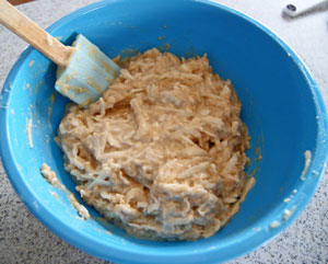 stirring ingredients for apple muffins