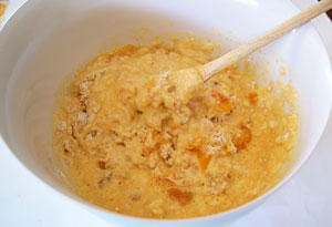 adding apricots to muffin mixture