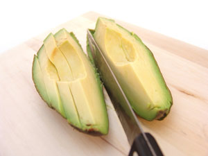 Cutting an avocado into slices