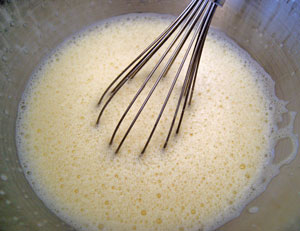 whisking oil, eggs and buttermilk