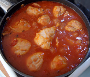 chicken cacciatore cooking in pan