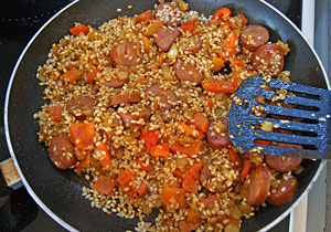 cooking the pepper, chorizo and rice