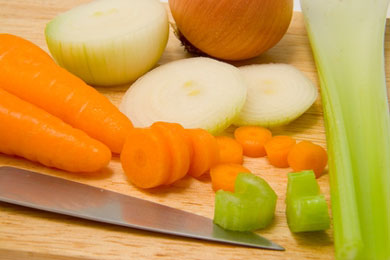 chopping vegetables for chicken stock