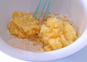 adding pineapple and banana to flour mixture