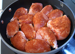 lemon chicken cooking in pan