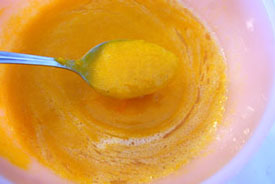 beating eggs, pumpkin and oil