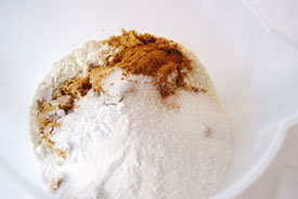 mixing flour, sugars, baking soda and spices
