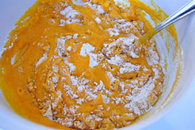 adding pumpkin mixture to flour mixture