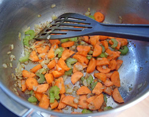 sauteeing the carrot and onion
