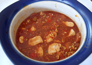 chicken pilaf in casserole dish ready to bake