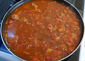 bringing the tomato and stock to the boil