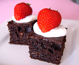 low fat brownies topped with yogurt and strawberries