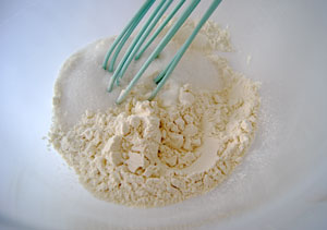 whisking together flour, sugar, cinamon and salt